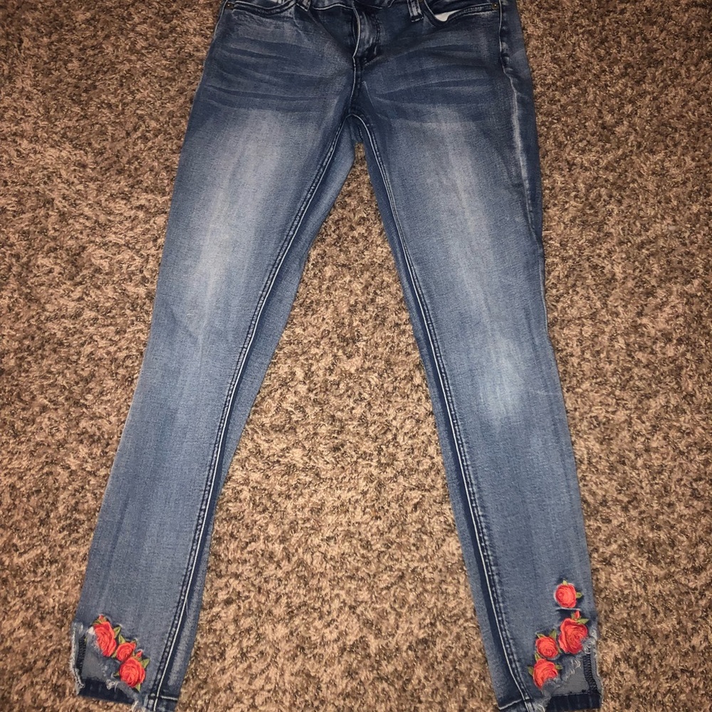 Jeans with rose detailing on the bottoms
